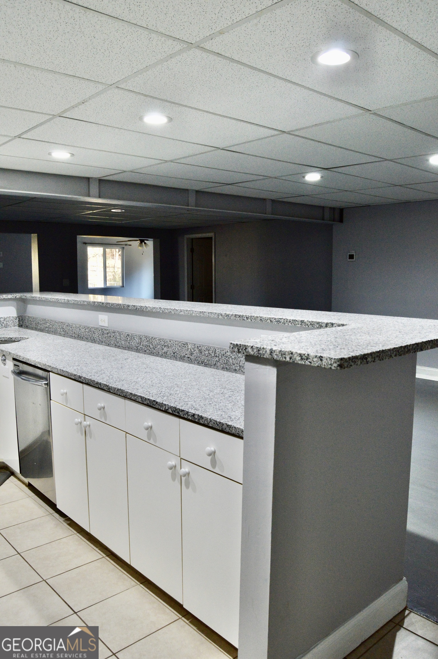 817 Brookside Drive Winder, GA 30680 - Photo 68 of 126 a spacious bathroom with a granite countertop sink and a mirror