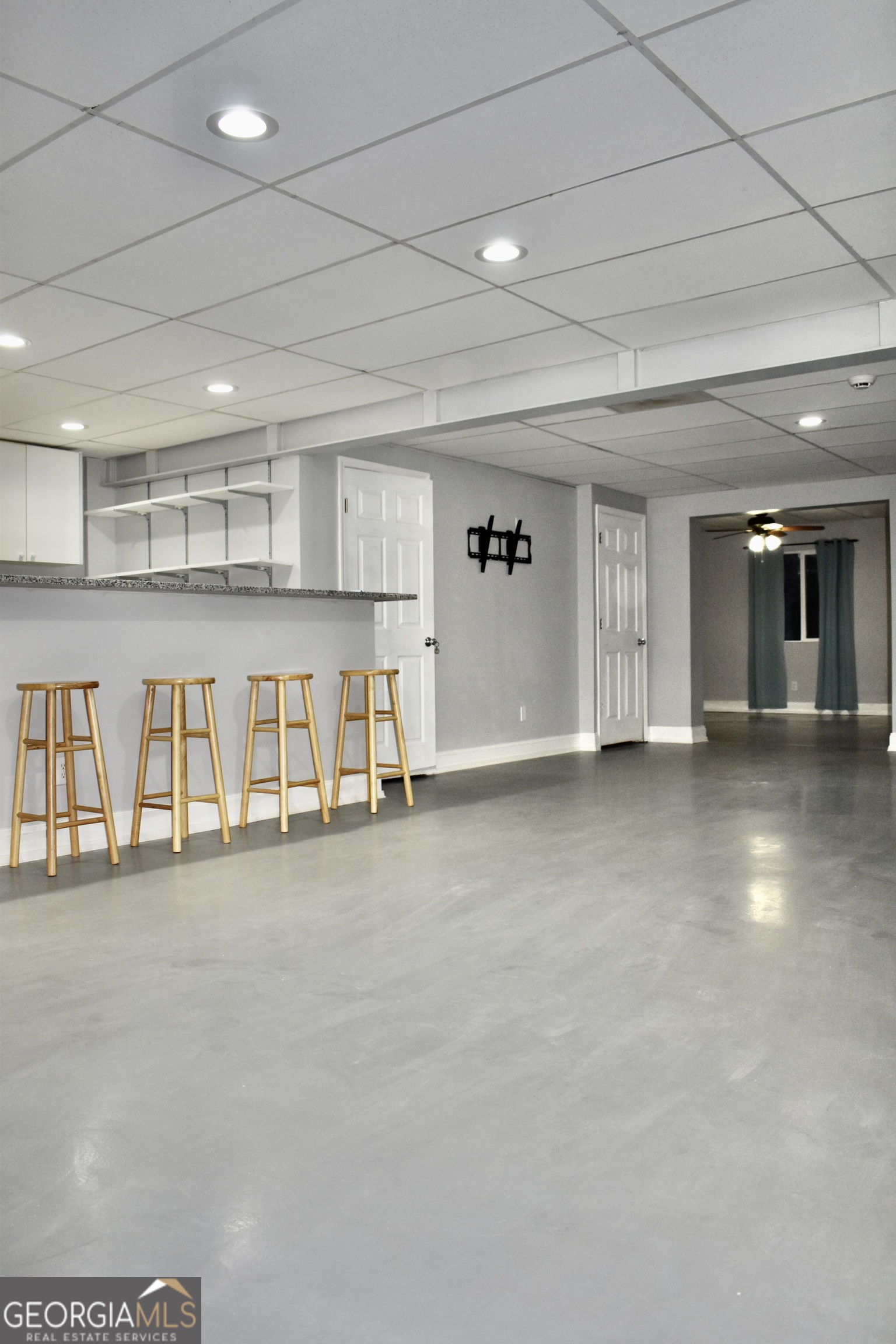 817 Brookside Drive Winder, GA 30680 - Photo 96 of 126 This open living area is located in the basement of the home.