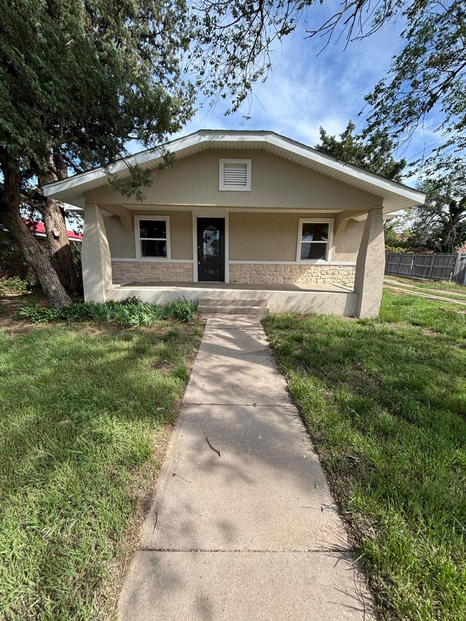a front view of house with yard
