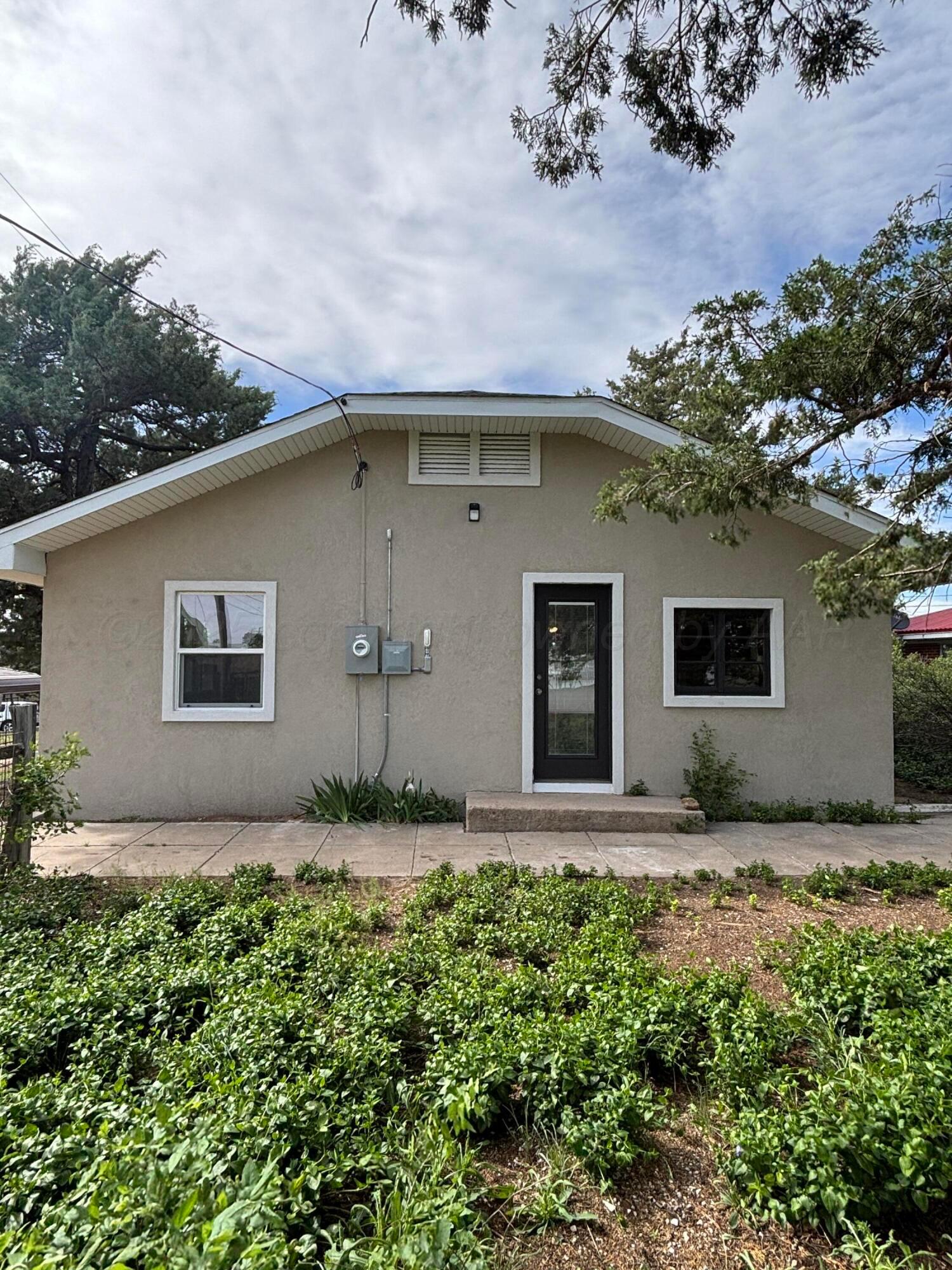 214 East Wichita Street Miami, TX 79059 - Photo 17 of 18 a front view of a house with garden