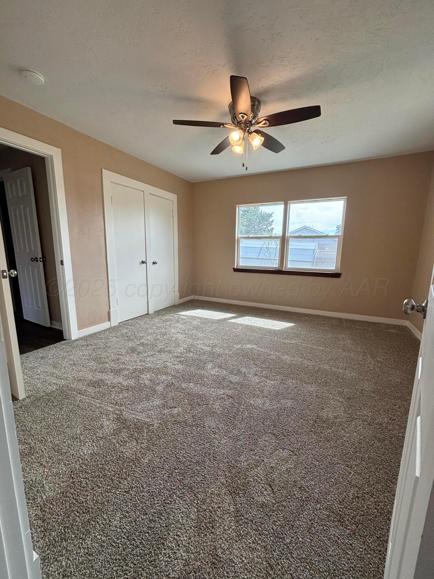 214 East Wichita Street Miami, TX 79059 - Photo 3 of 18 a view of an empty room and window