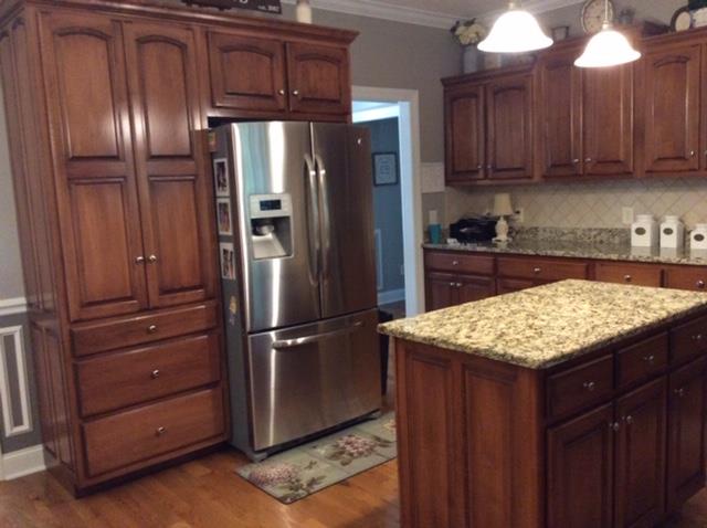 1109 Loftin Road Columbia, TN 38401 - Photo 8 of 18 a kitchen with granite countertop stainless steel appliances and refrigerator