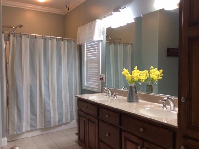 1109 Loftin Road Columbia, TN 38401 - Photo 10 of 18 a bathroom with a double vanity sink and a mirror