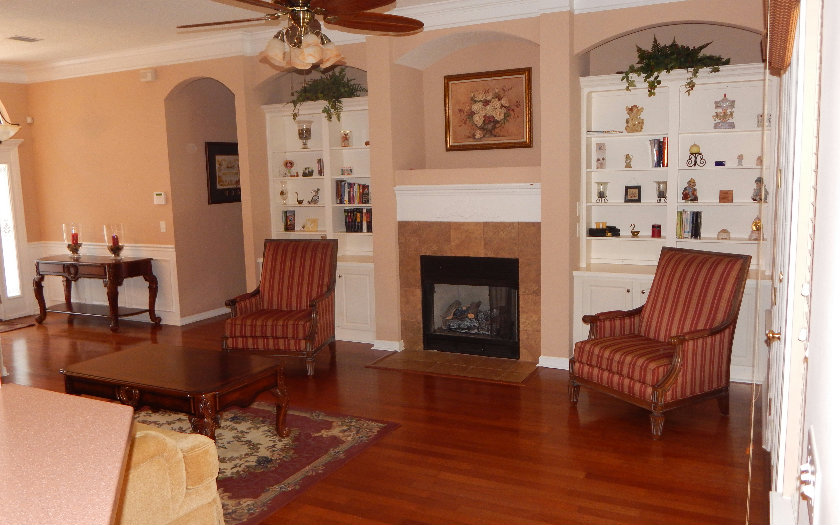 96784 Blackrock Road Yulee, FL 32097 - Photo 5 of 11 a living room with furniture and a fireplace