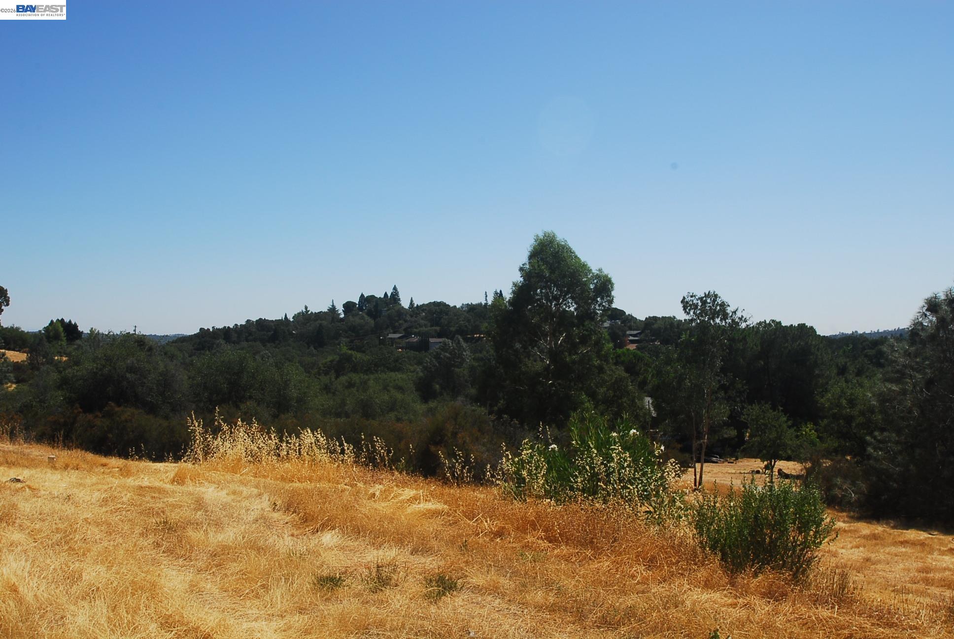 3341 Rancho Tierra Court Cameron Park, CA 95682 - Photo 15 of 28 a view of a lake with mountains in the background