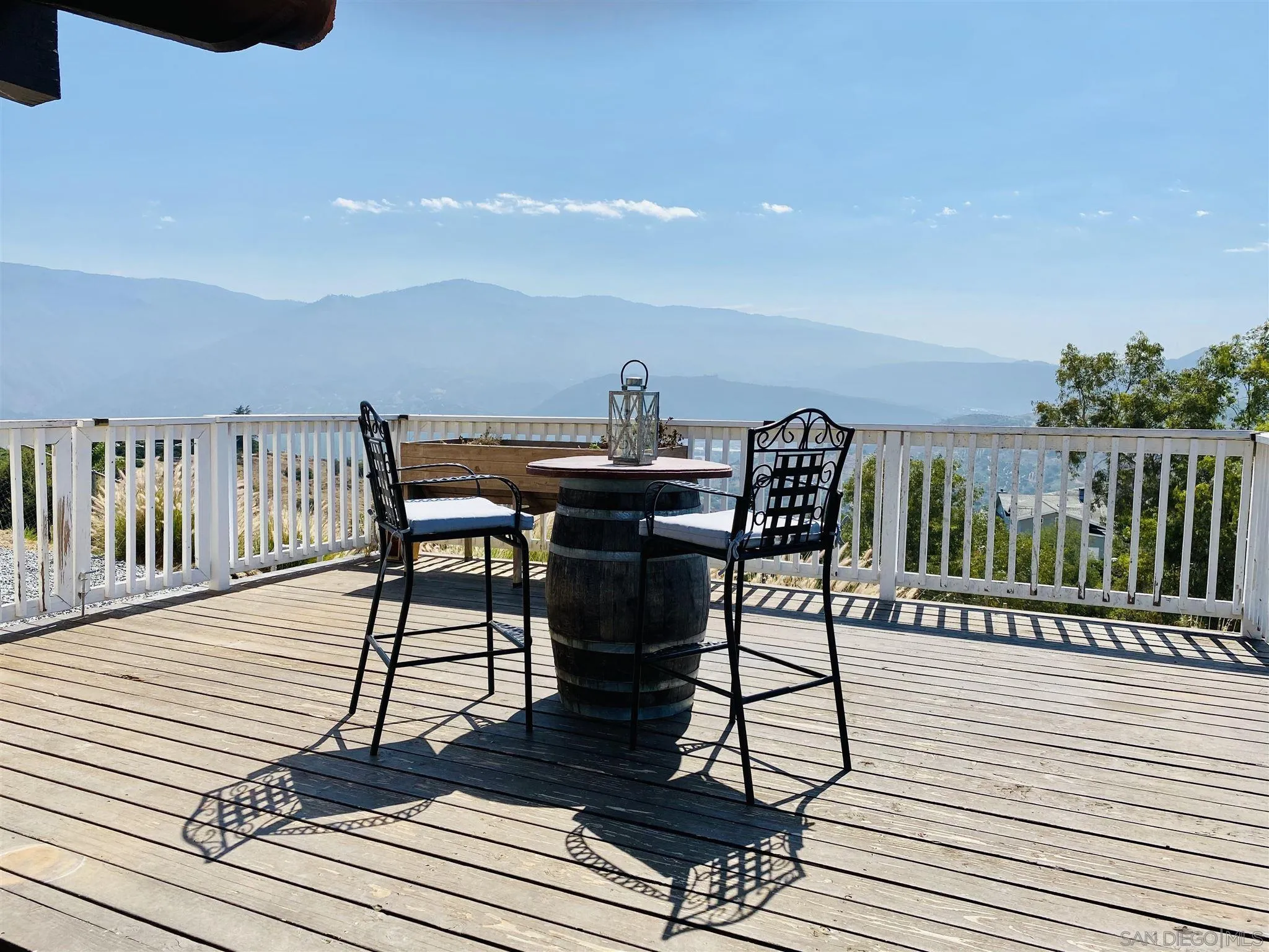 32251 Cole Grade Road Valley Center, CA 92082 - Photo 32 of 54 a view of a terrace with wooden floor and outdoor seating