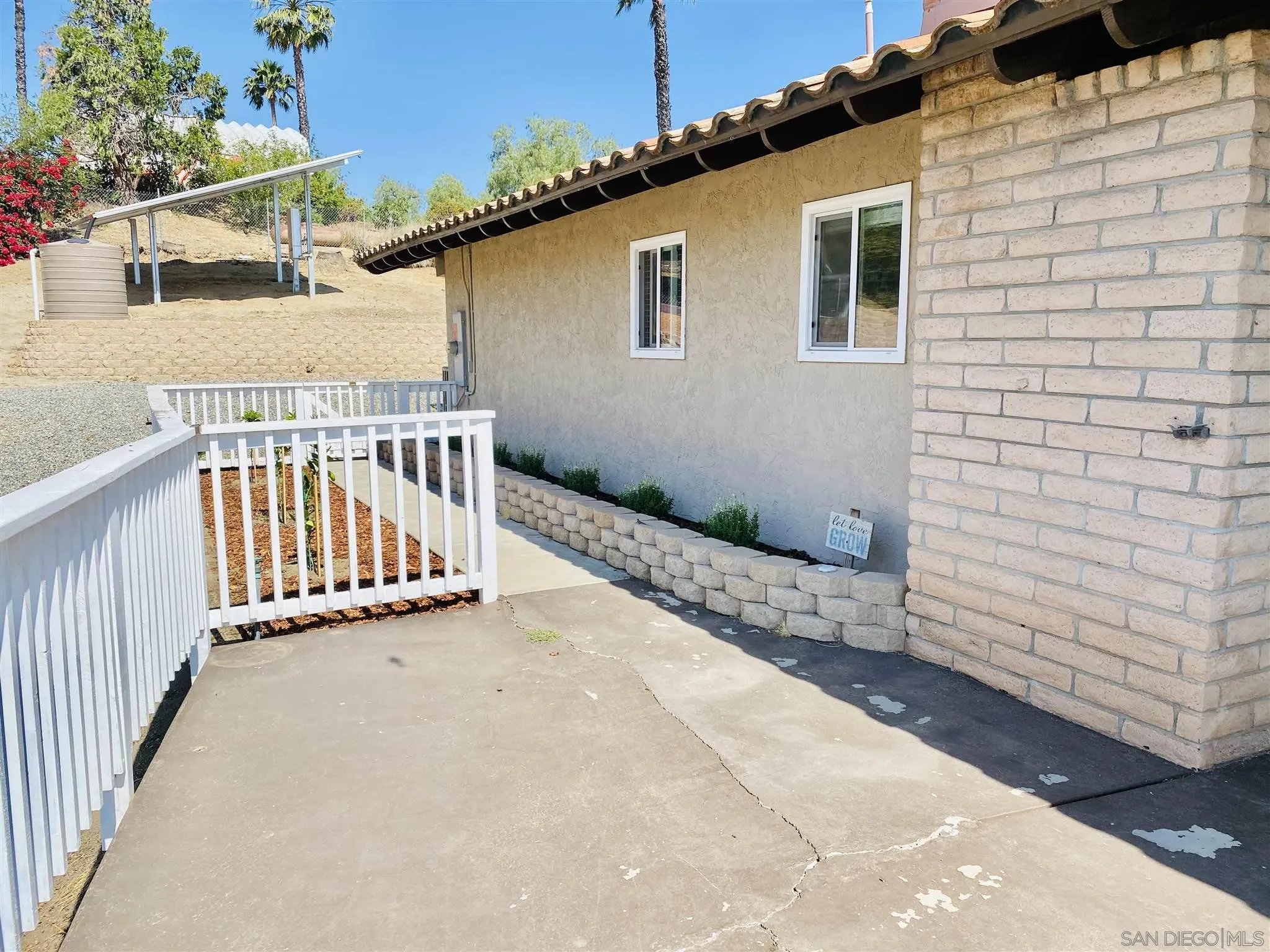 32251 Cole Grade Road Valley Center, CA 92082 - Photo 35 of 54 a view of a house with wooden fence