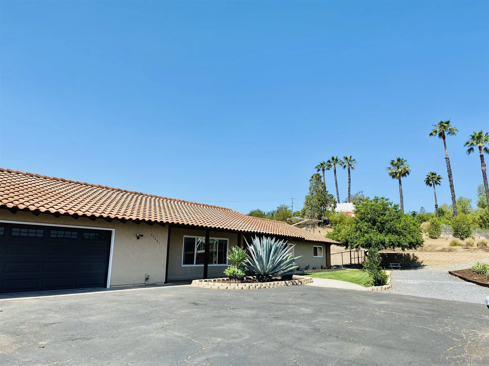 32251 Cole Grade Road Valley Center, CA 92082 - Photo 44 of 54 a front view of a house with a yard