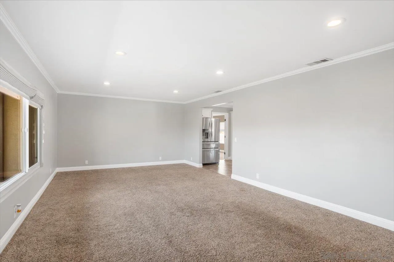 32251 Cole Grade Road Valley Center, CA 92082 - Photo 5 of 54 an empty room with windows and closet