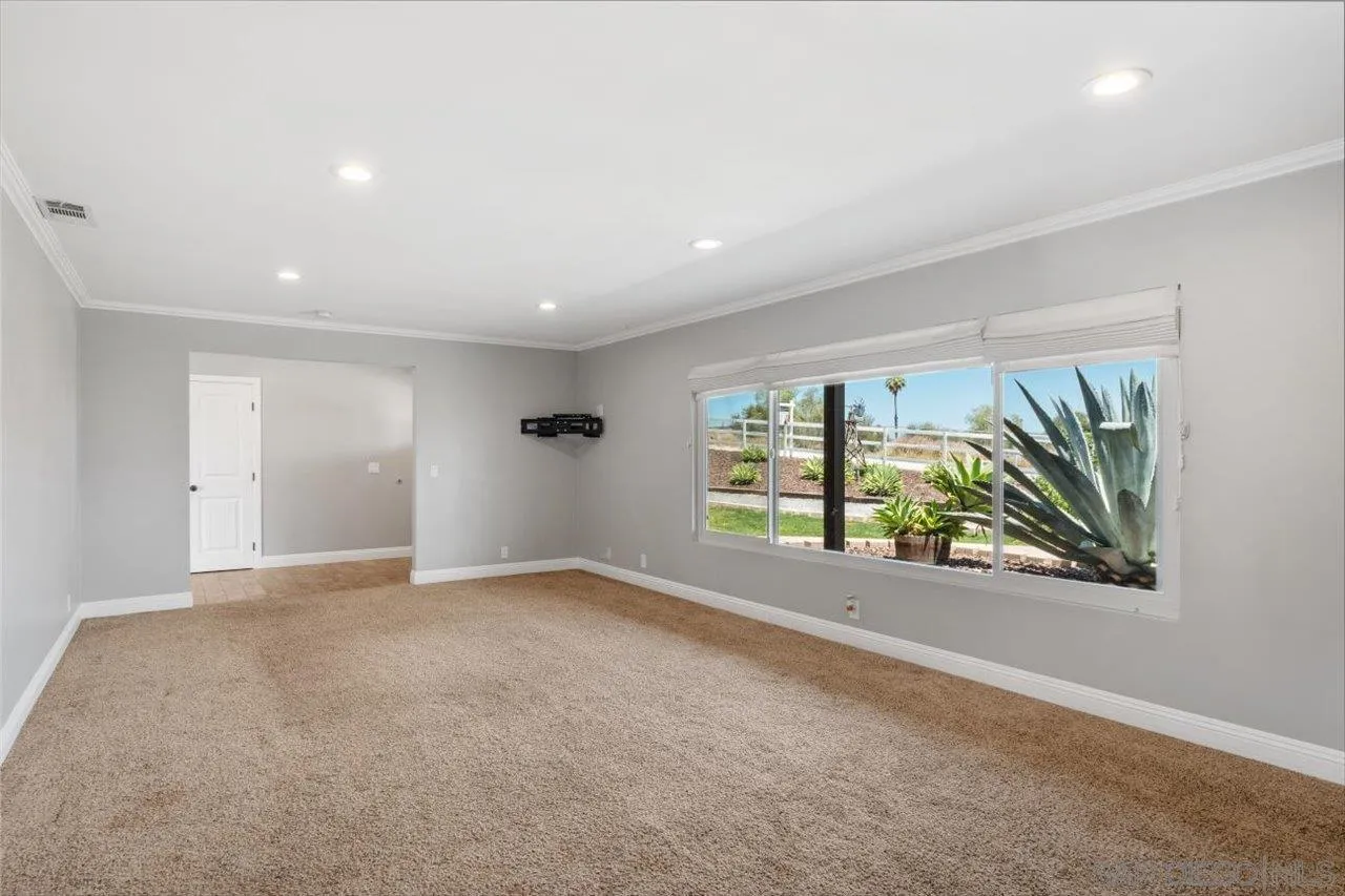 32251 Cole Grade Road Valley Center, CA 92082 - Photo 6 of 54 a view of an empty room with a window