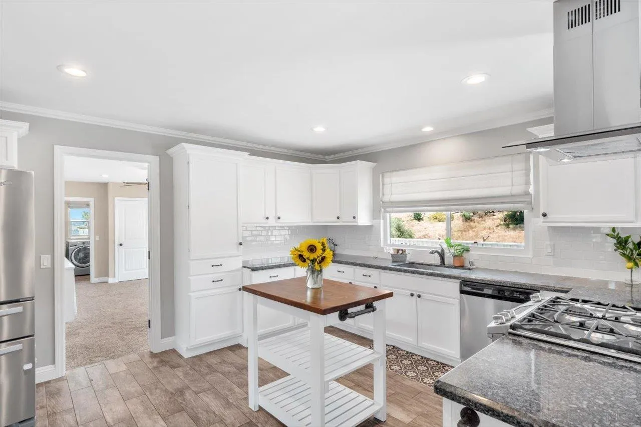 32251 Cole Grade Road Valley Center, CA 92082 - Photo 10 of 54 a kitchen with a sink appliances and cabinets