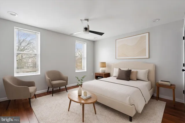 a bedroom with furniture and a window