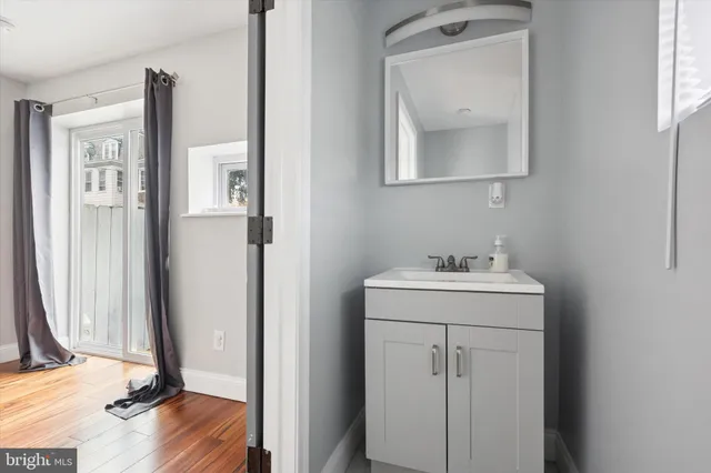 a bathroom with a sink toilet and vanity