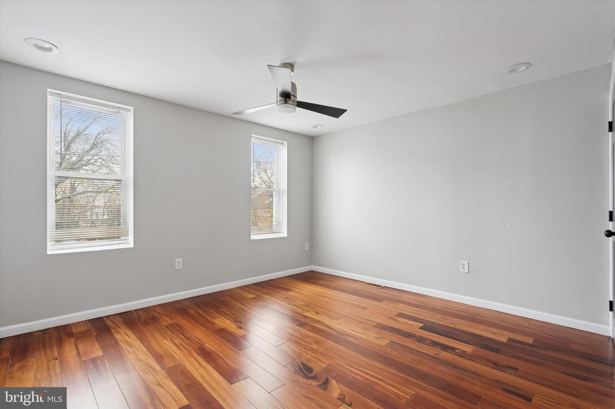 213 East Phil Ellena Street Philadelphia, PA 19119 - Photo 13 of 28 a view of an empty room with wooden floor and a window