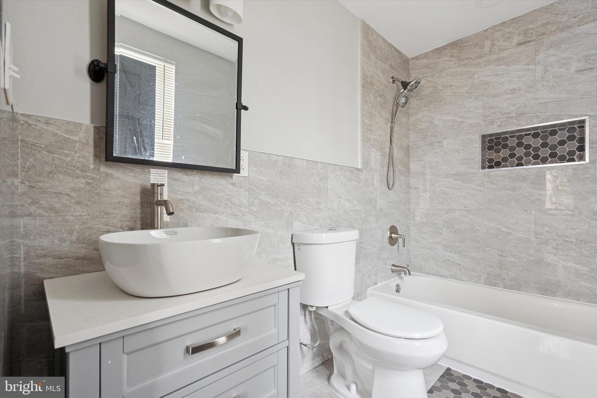 213 East Phil Ellena Street Philadelphia, PA 19119 - Photo 15 of 28 a bathroom with a sink a toilet and shower