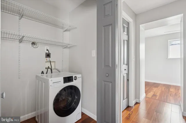 a view of a hallway with washer and dryer