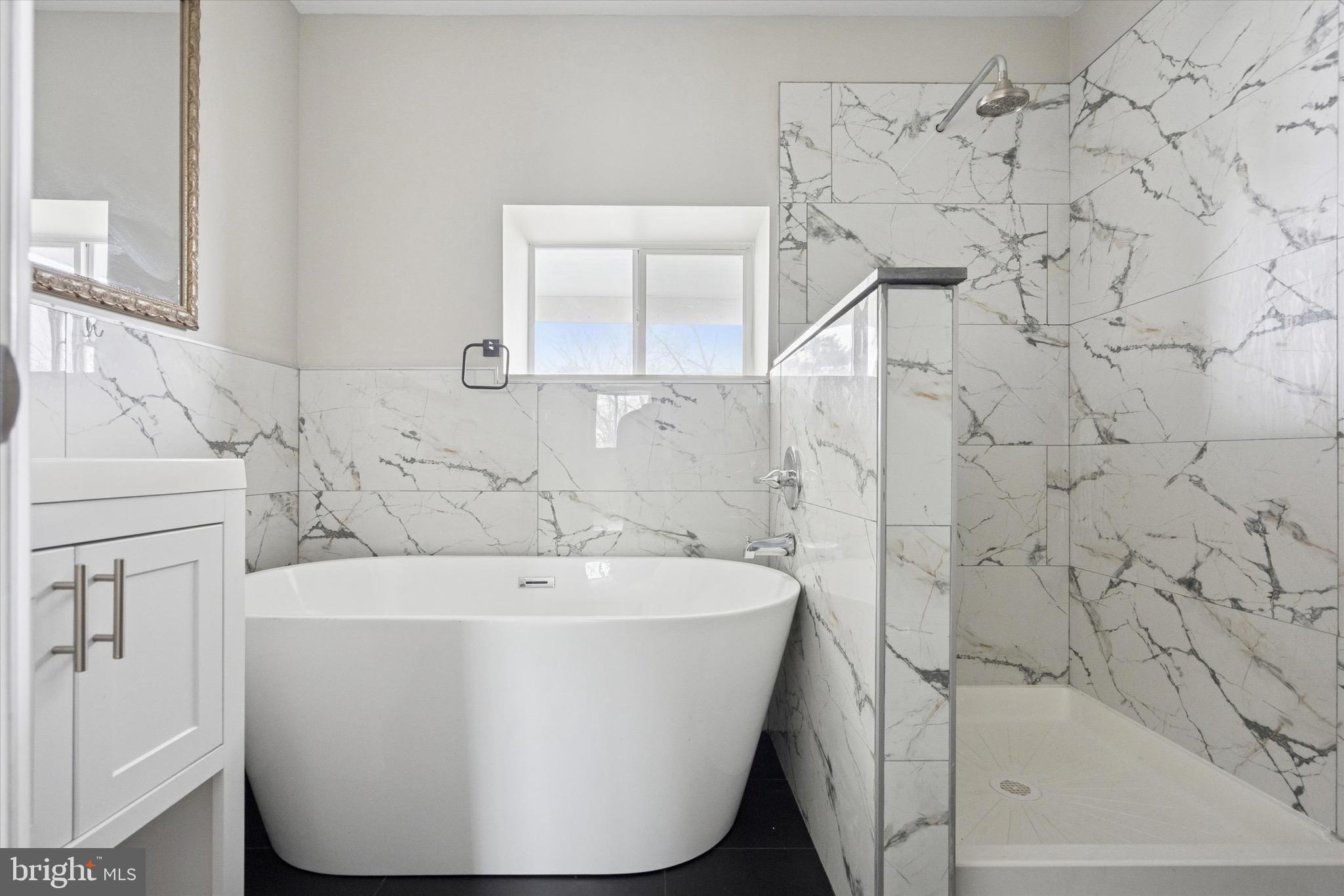 213 East Phil Ellena Street Philadelphia, PA 19119 - Photo 21 of 28 a white bath tub sitting in a bathroom