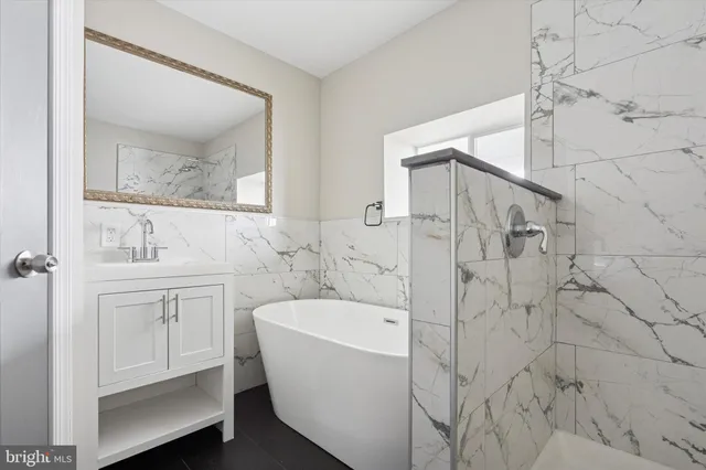 a bathroom with a bathtub and a sink