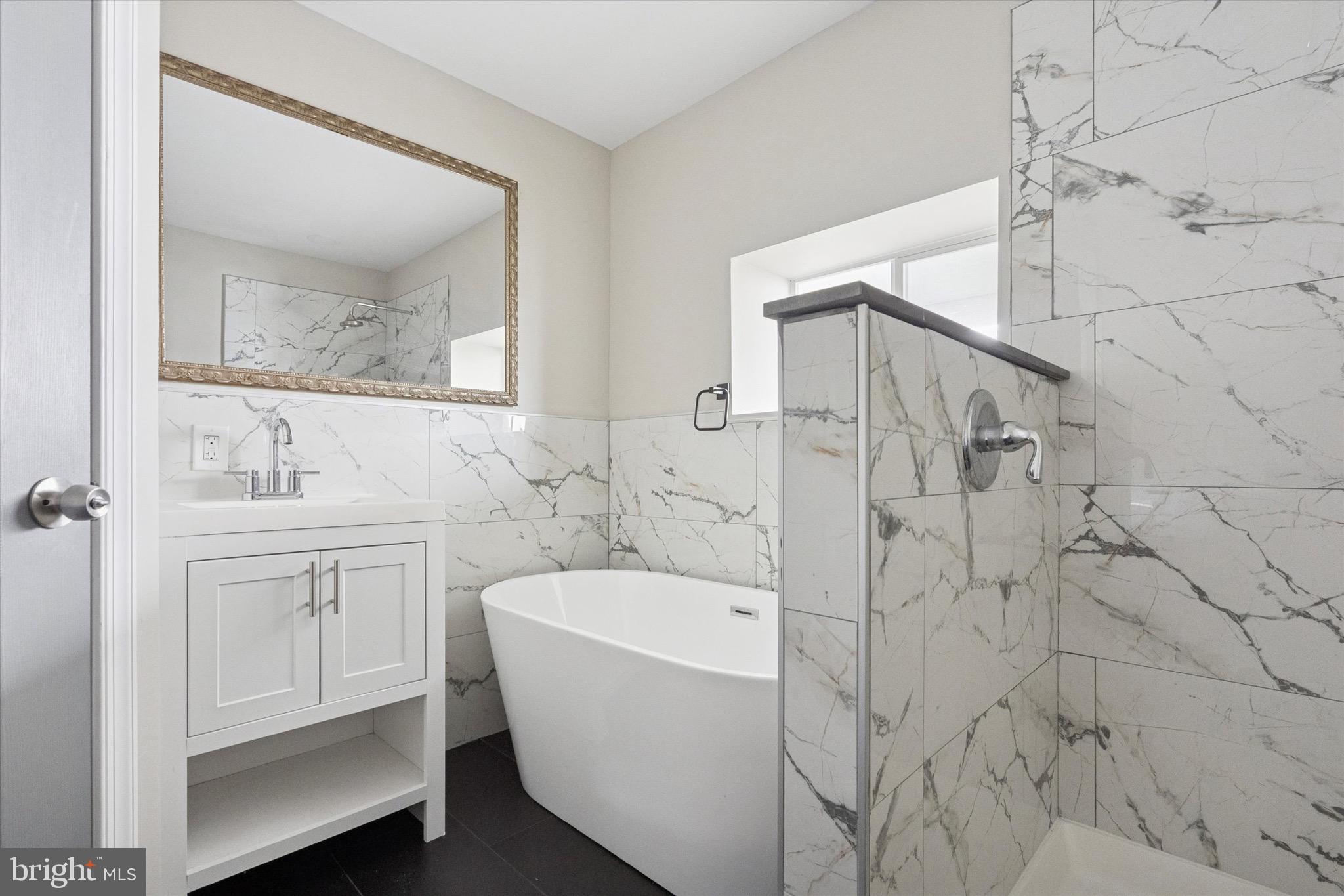 213 East Phil Ellena Street Philadelphia, PA 19119 - Photo 22 of 28 a bathroom with a bathtub and a sink