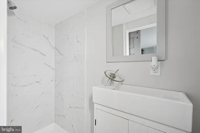 a bathroom with a sink and vanity