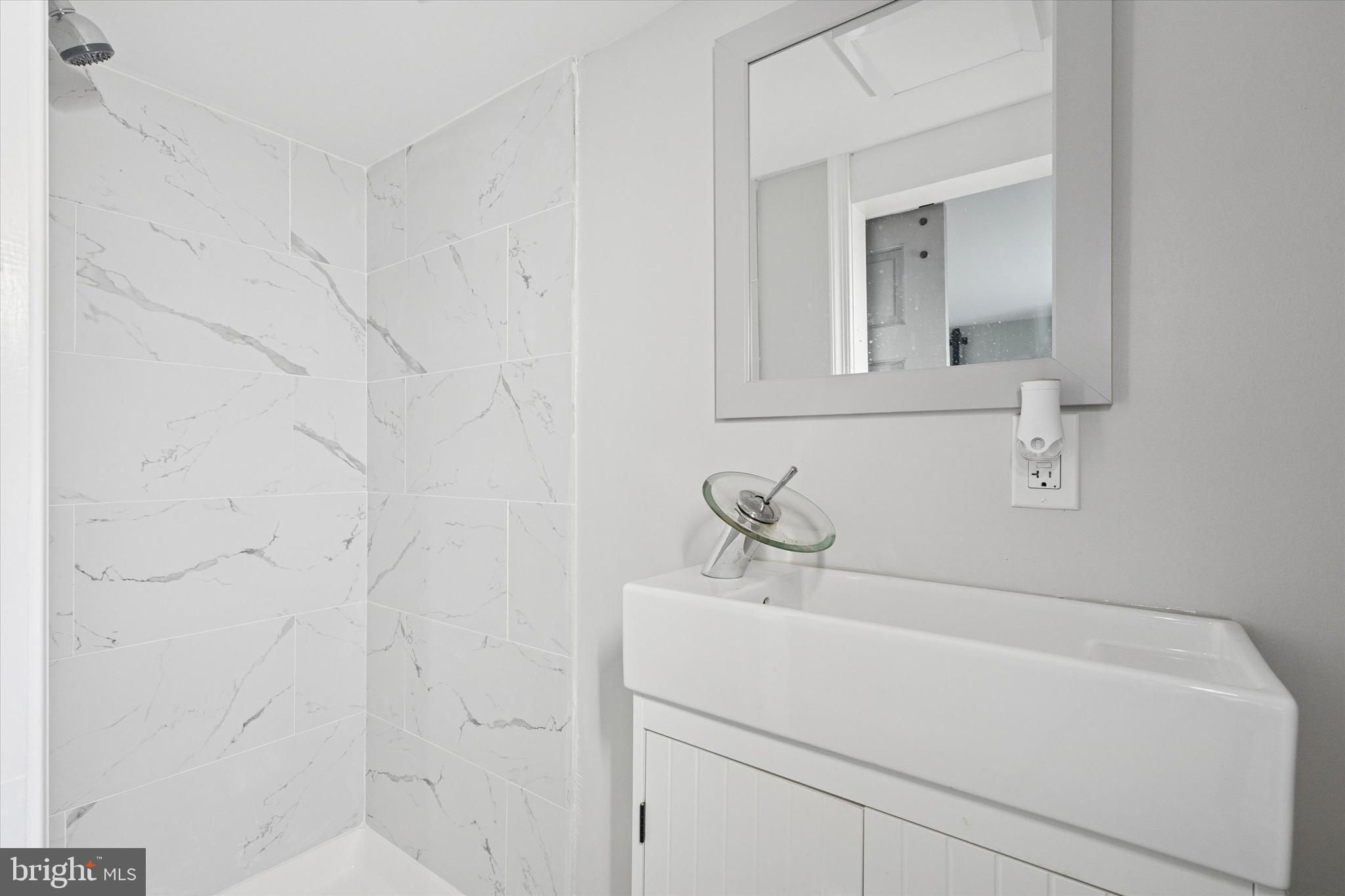 213 East Phil Ellena Street Philadelphia, PA 19119 - Photo 25 of 28 a bathroom with a sink and vanity
