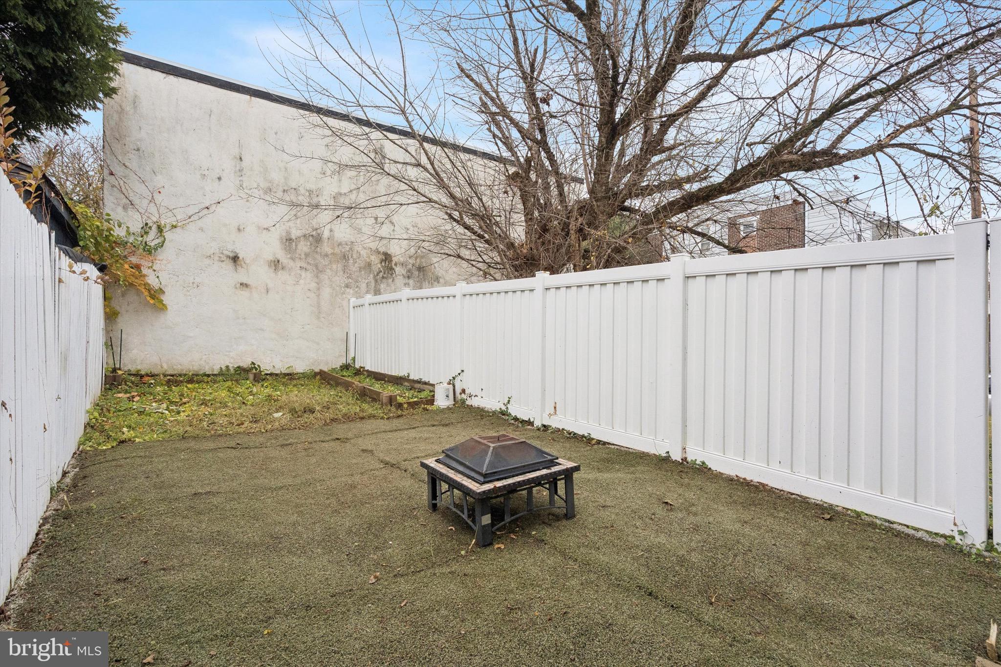 213 East Phil Ellena Street Philadelphia, PA 19119 - Photo 26 of 28 a view of a backyard with white fence