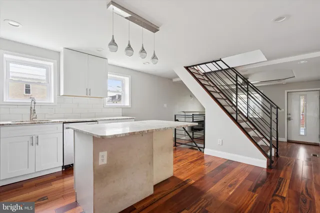a view of a kitchen cabinets and wooden floor