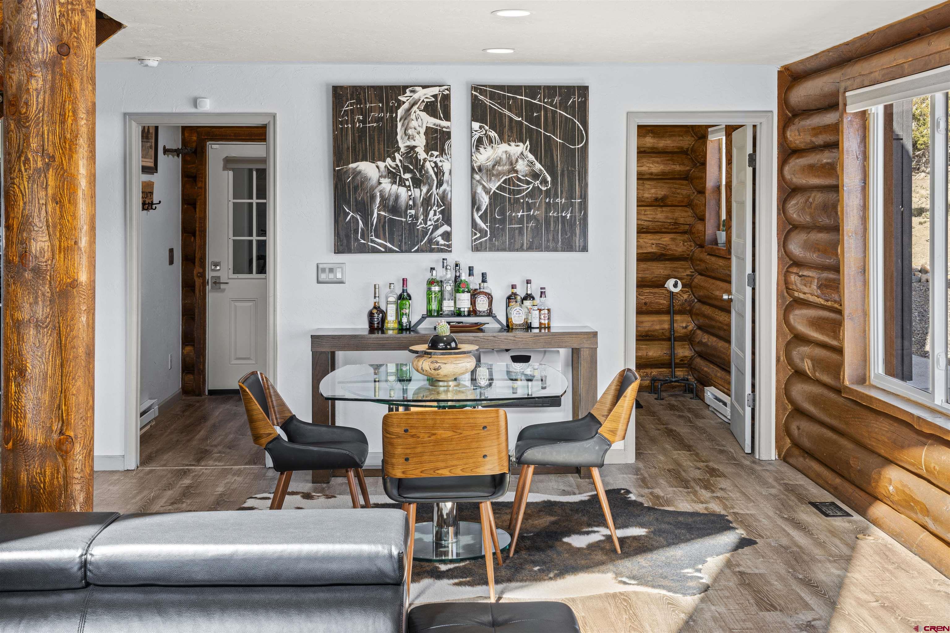 70848 Buckhorn Road Montrose, CO 81403 - Photo 11 of 43 a dining room with furniture and wooden floor