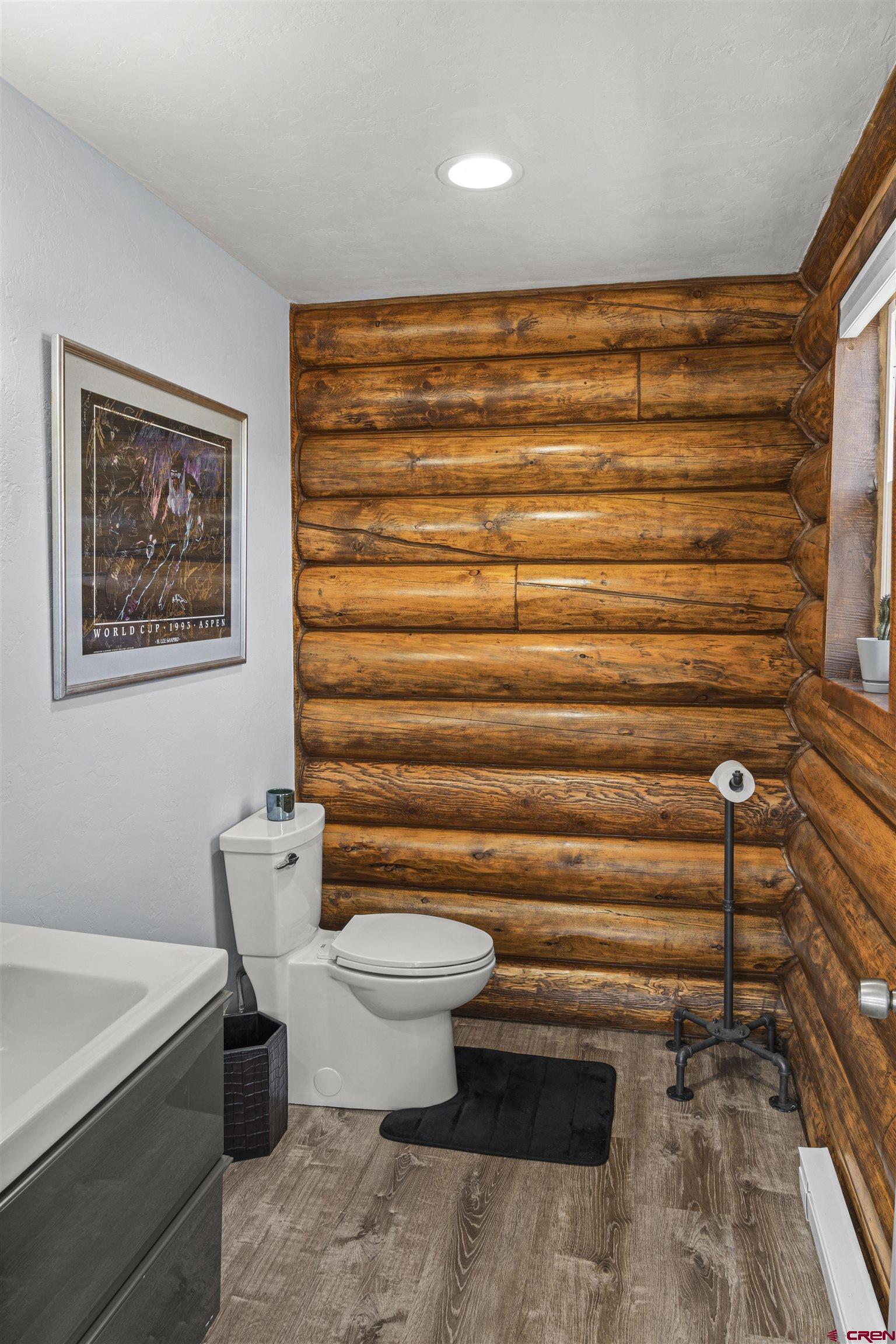 70848 Buckhorn Road Montrose, CO 81403 - Photo 14 of 43 a bathroom with a toilet and a shower curtain
