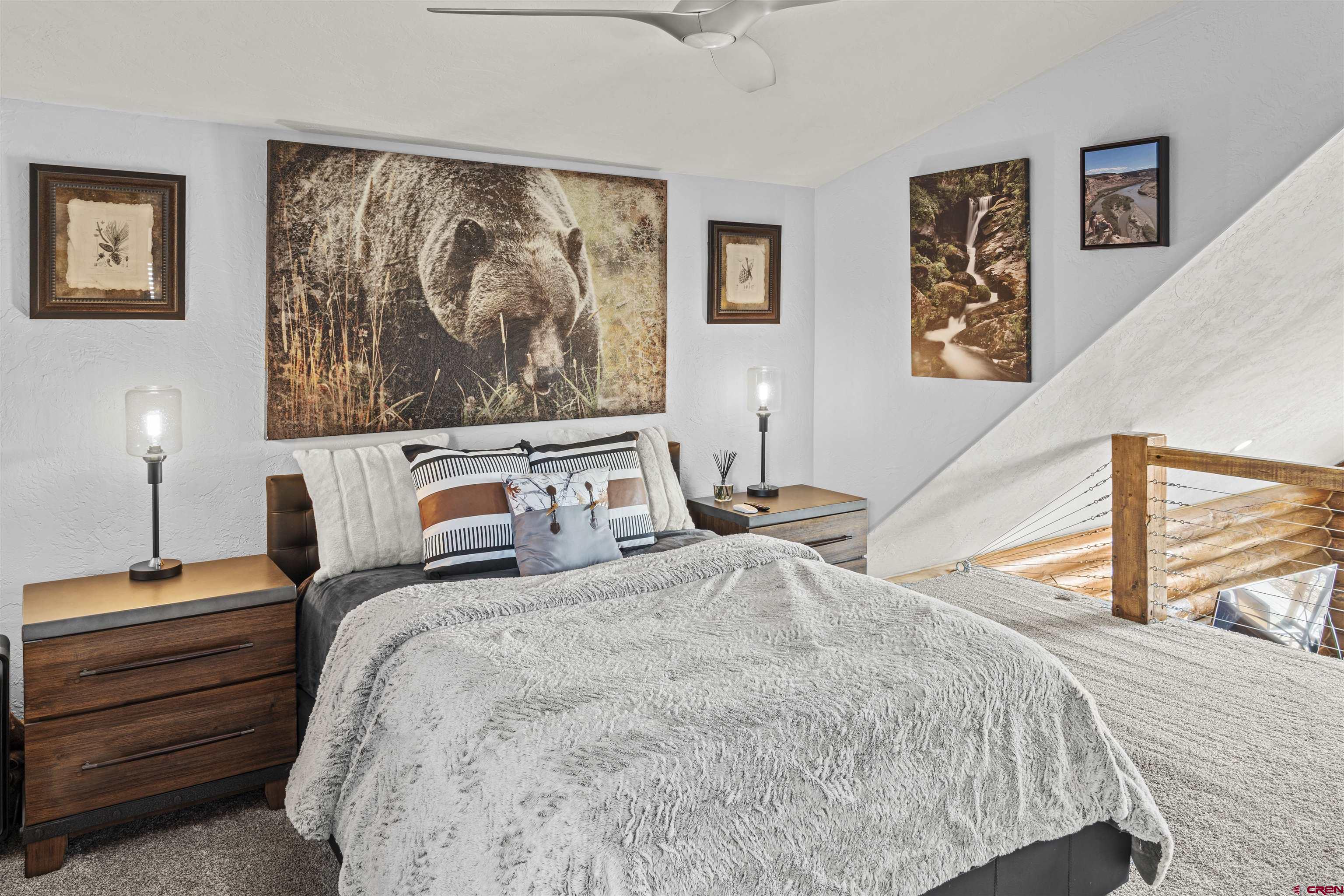 70848 Buckhorn Road Montrose, CO 81403 - Photo 18 of 43 a bedroom with a bed and a couch