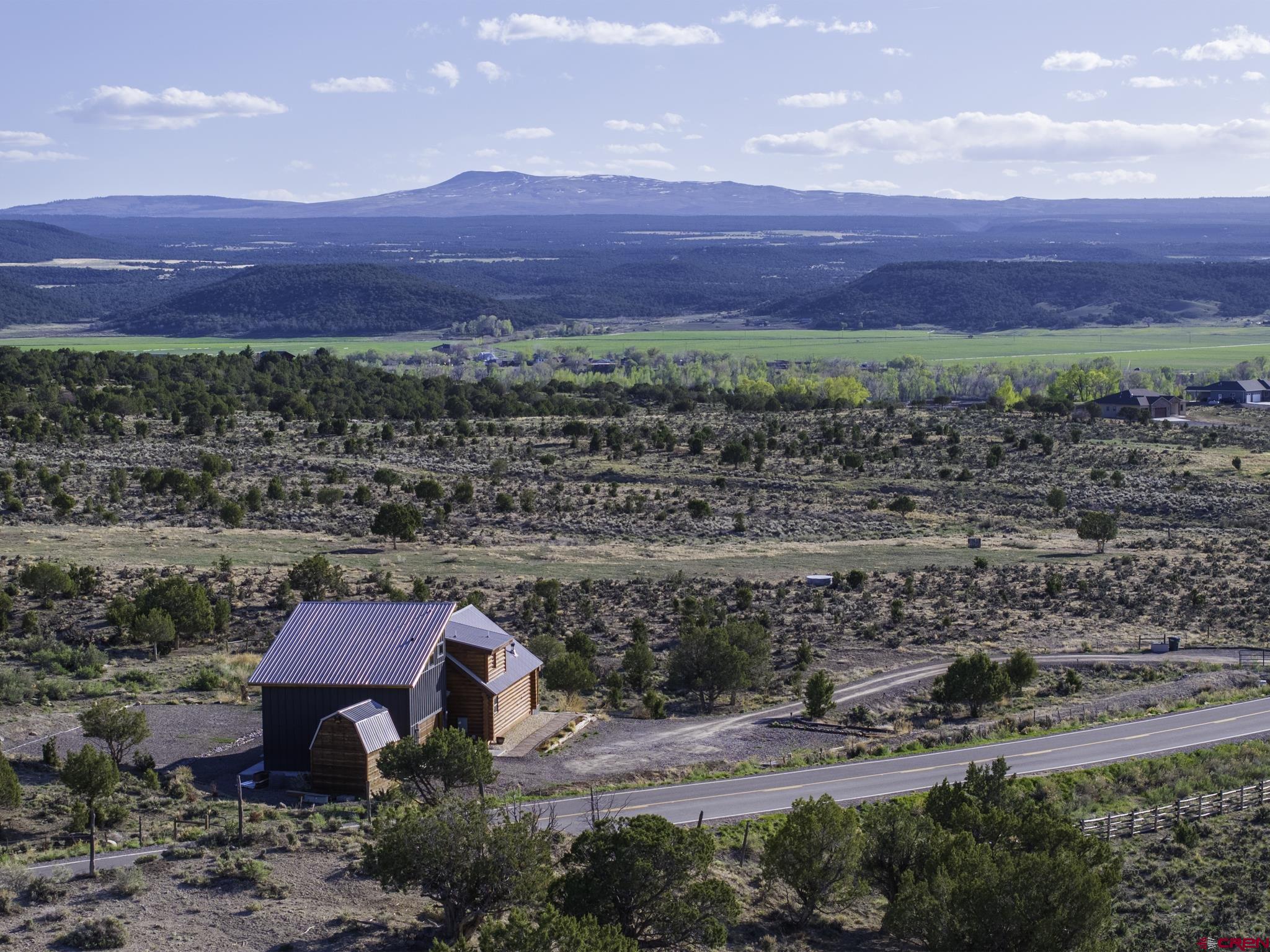 70848 Buckhorn Road Montrose, CO 81403 - Photo 2 of 43 a view of a big yard with an ocean view