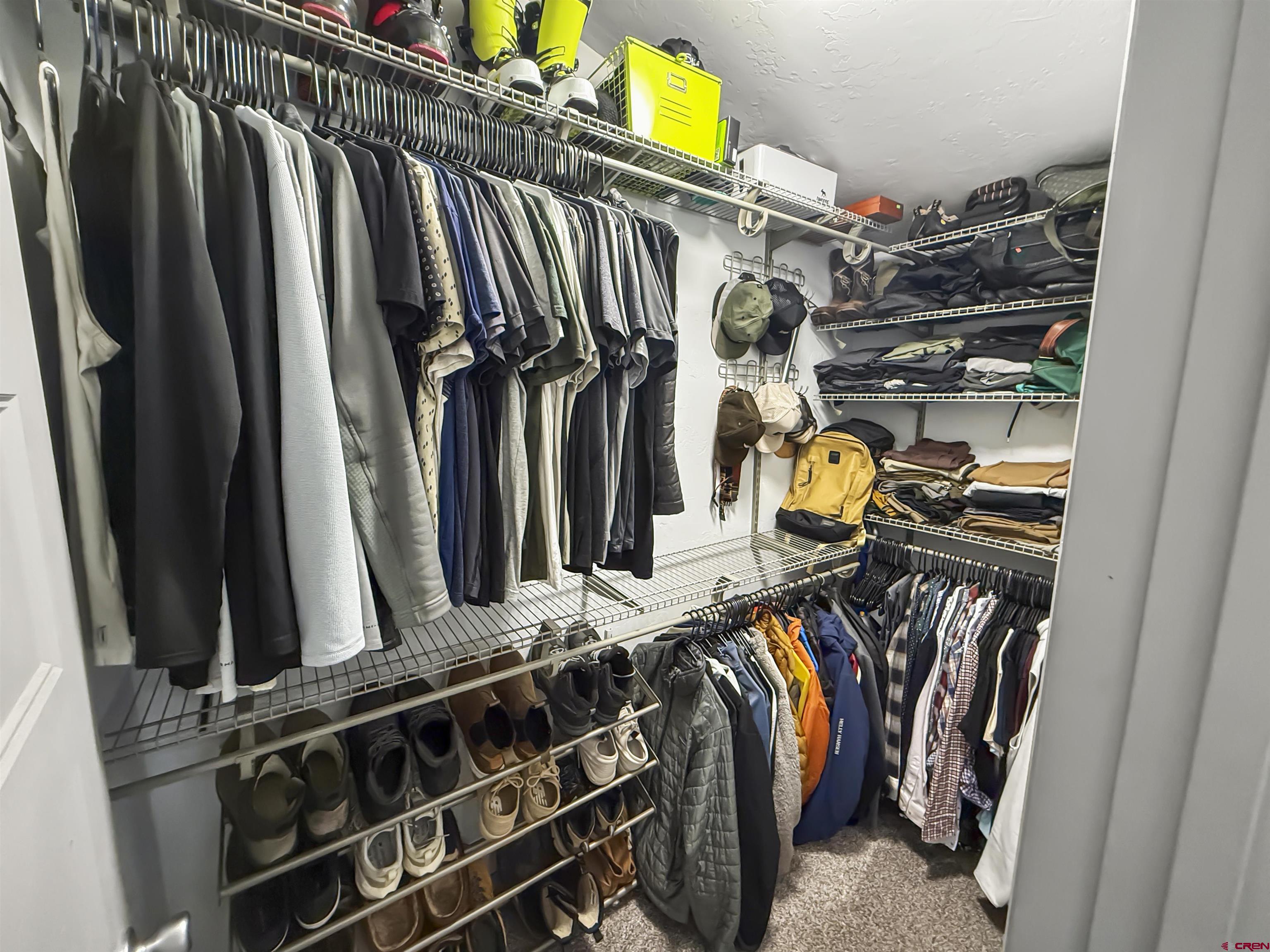 70848 Buckhorn Road Montrose, CO 81403 - Photo 22 of 43 a view of walk in closet with clothes and shoes