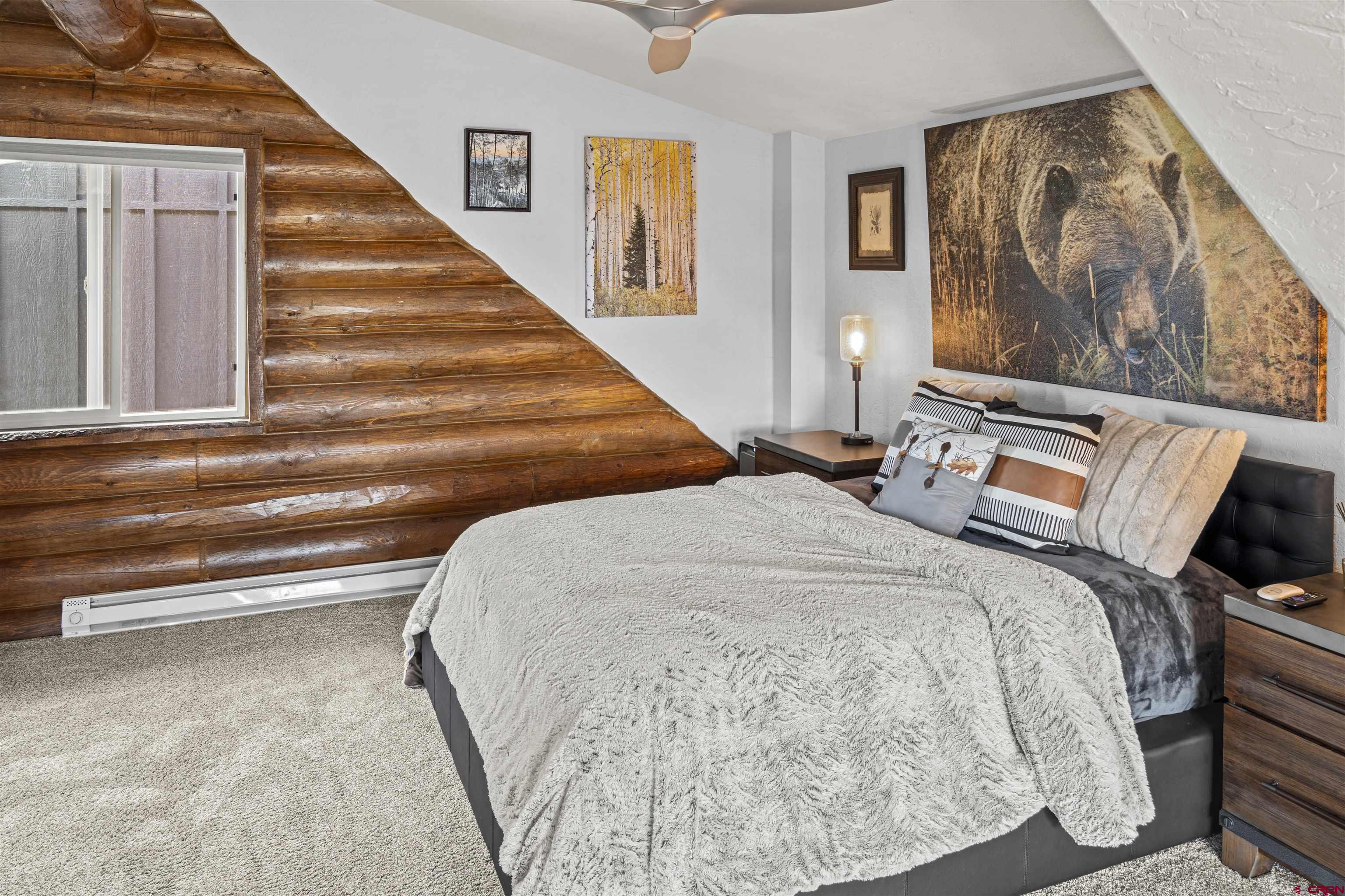 70848 Buckhorn Road Montrose, CO 81403 - Photo 23 of 43 a bedroom with a bed and wall painting