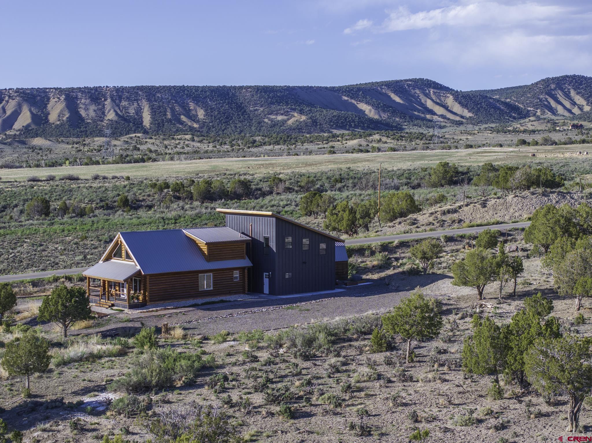 70848 Buckhorn Road Montrose, CO 81403 - Photo 3 of 43 a view of a houses with a yard