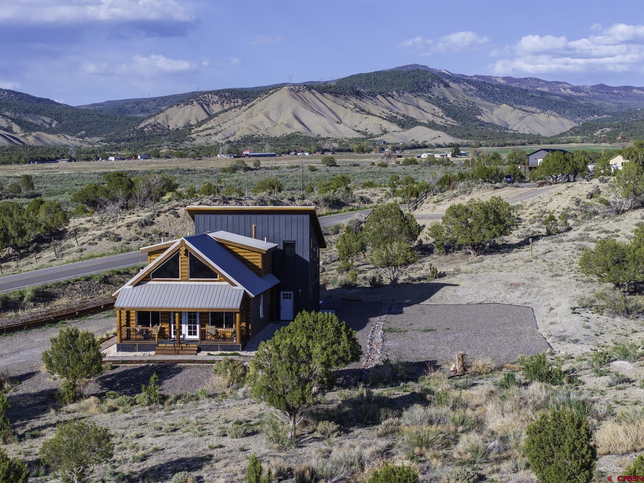 70848 Buckhorn Road Montrose, CO 81403 - Photo 5 of 43 an aerial view of a house with a garden