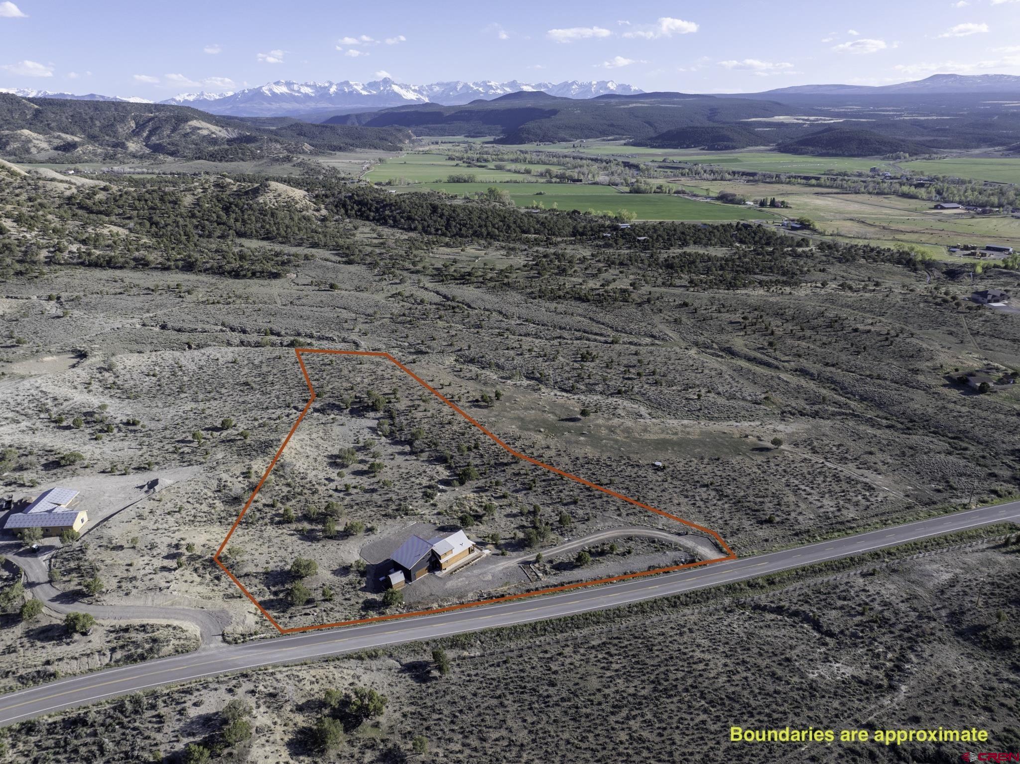 70848 Buckhorn Road Montrose, CO 81403 - Photo 6 of 43 a view of a dry yard with wooden floor