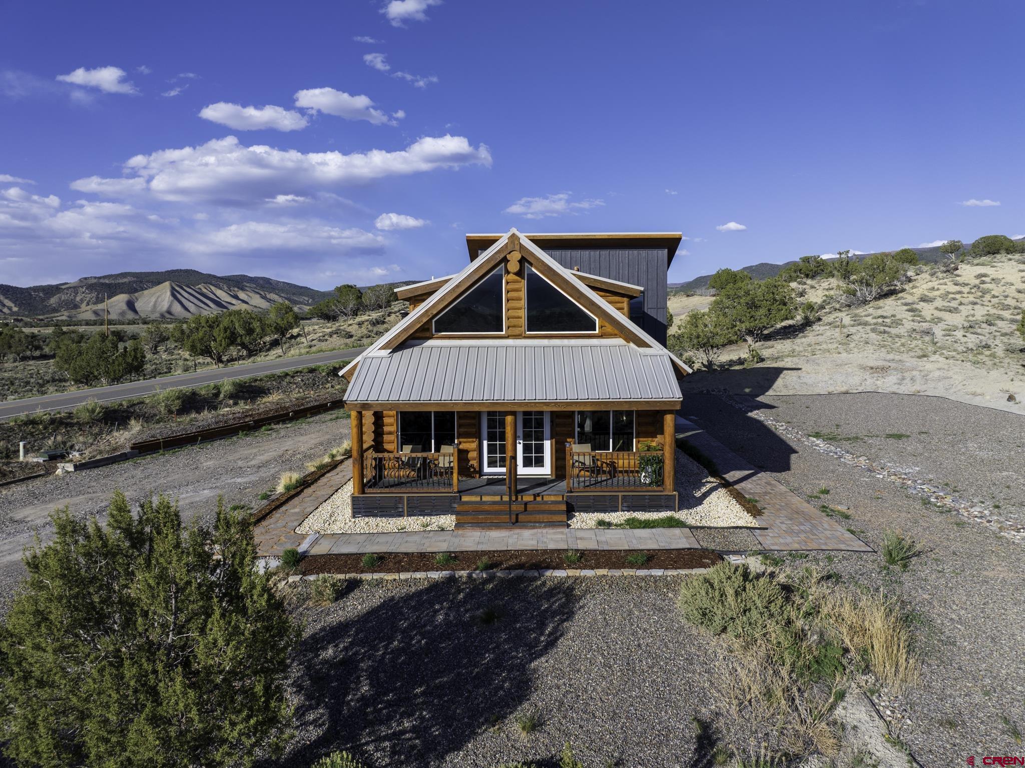 70848 Buckhorn Road Montrose, CO 81403 - Photo 8 of 43 a view of a big house with a big yard