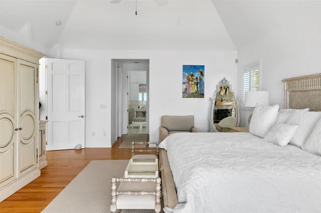 a bedroom with a large bed and a couch