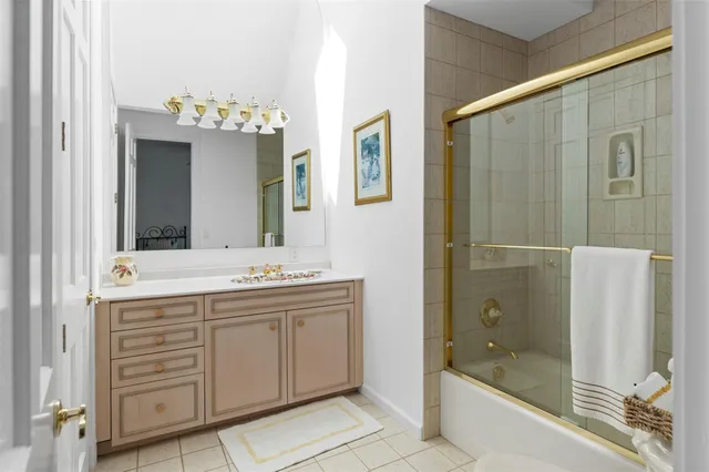 a bathroom with a bathtub a sink and a shower