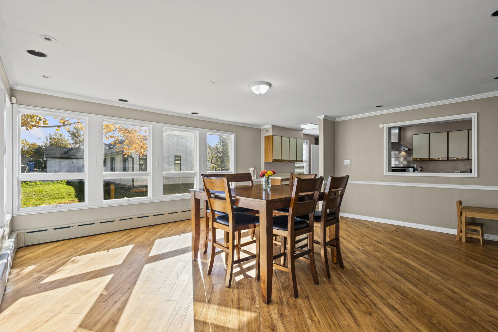 1615 Greenwood Road Glenview, IL 60026 - Photo 11 of 41 a view of a dining room with furniture a rug and wooden floor