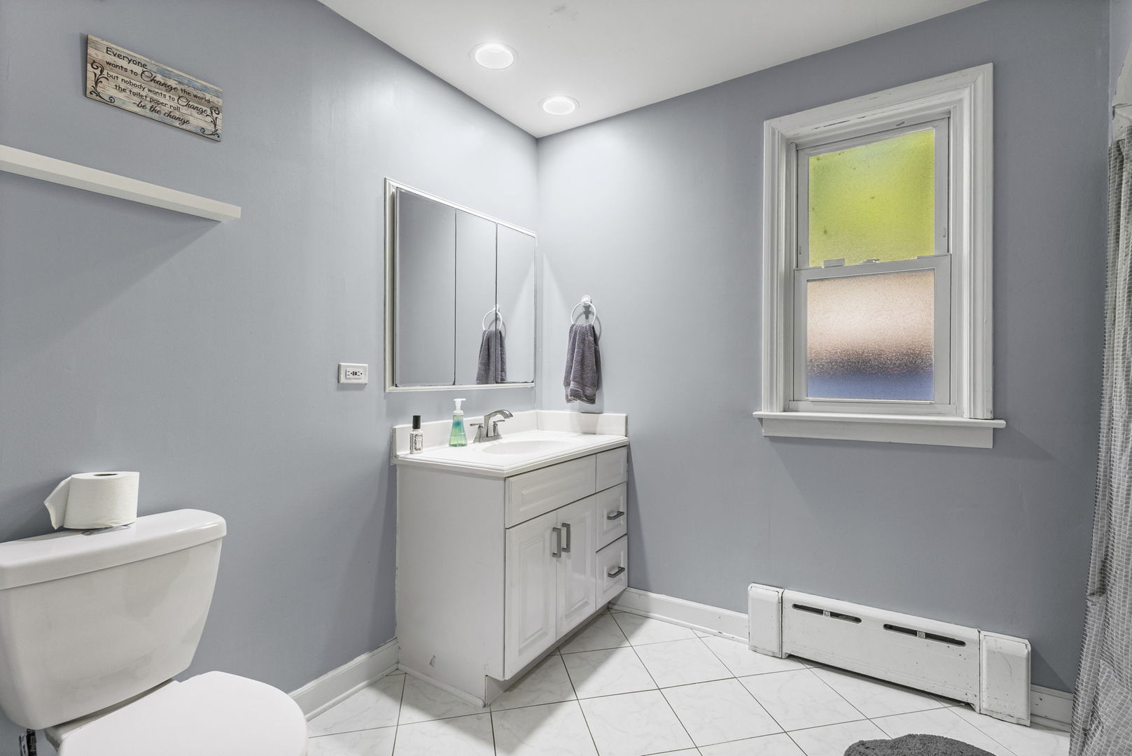 1615 Greenwood Road Glenview, IL 60026 - Photo 21 of 41 a bathroom with a toilet sink and mirror