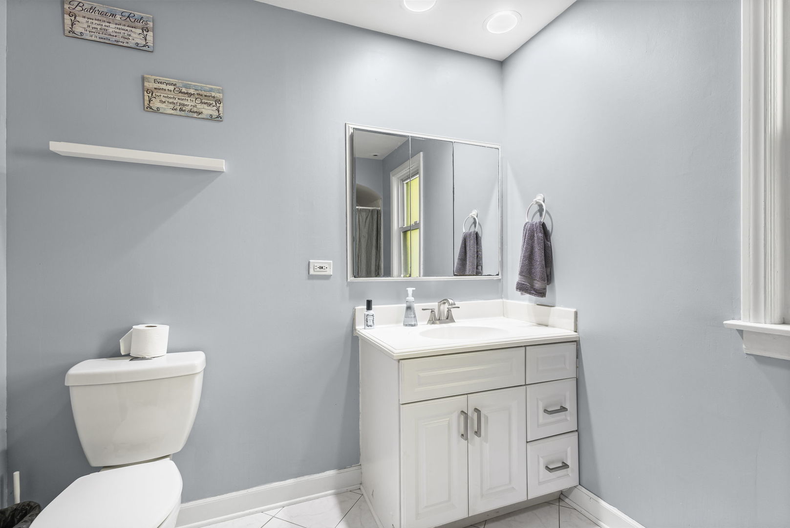 1615 Greenwood Road Glenview, IL 60026 - Photo 24 of 41 a bathroom with a toilet sink and mirror