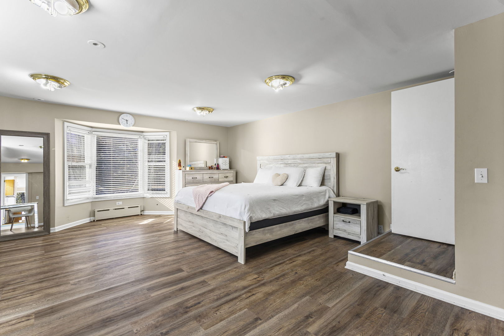 1615 Greenwood Road Glenview, IL 60026 - Photo 26 of 41 a bedroom with a bed and wooden floor