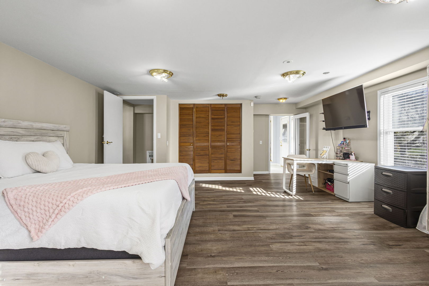 1615 Greenwood Road Glenview, IL 60026 - Photo 27 of 41 a spacious bedroom with a large bed and wooden floor