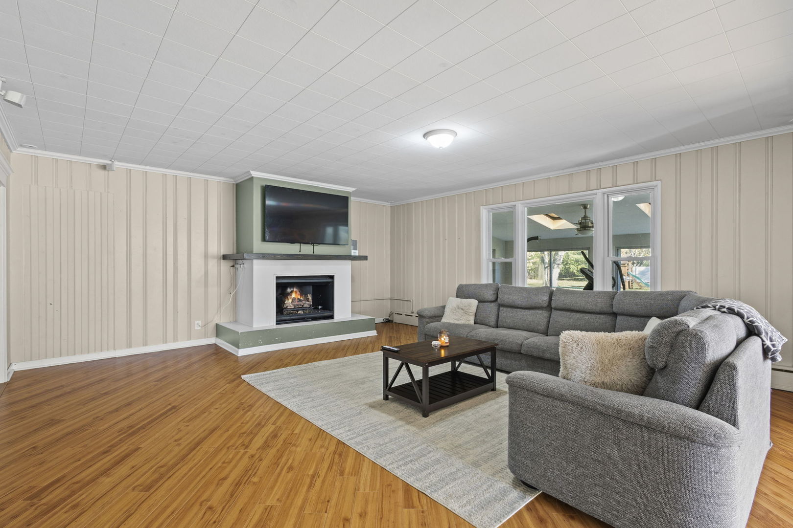 1615 Greenwood Road Glenview, IL 60026 - Photo 9 of 41 a living room with furniture and a fireplace