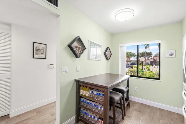 a view of a livingroom with furniture and workspace