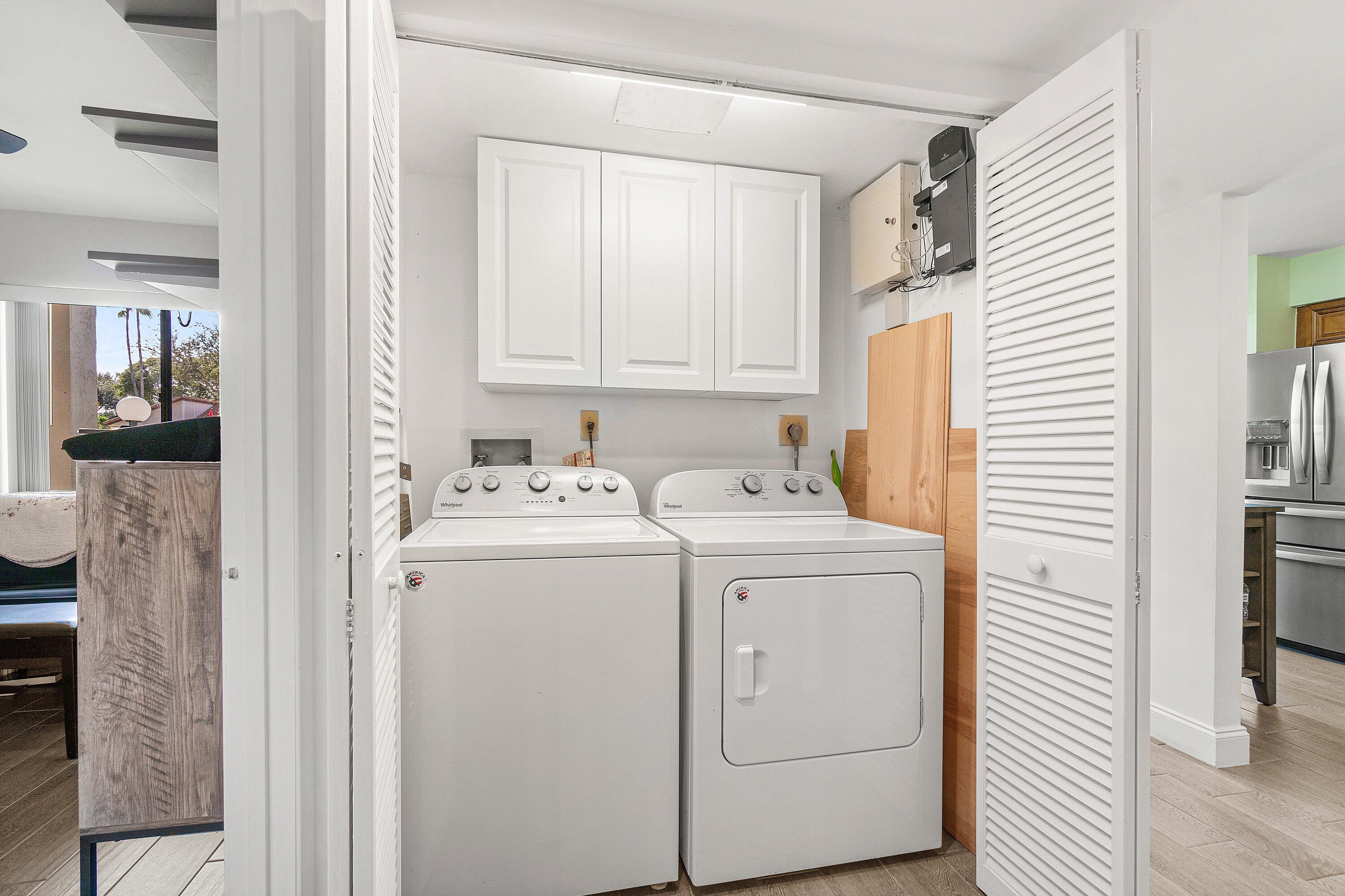 6149 Pointe Regal Circle, Unit 108 Delray Beach, FL 33484 - Photo 16 of 56 a utility room with dryer and washer