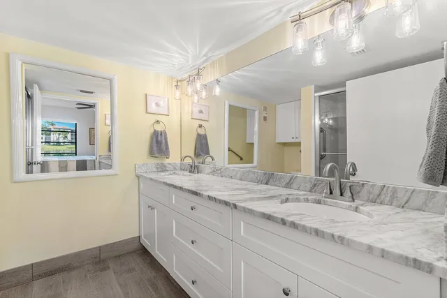 a view of a bathroom vanity and a tub