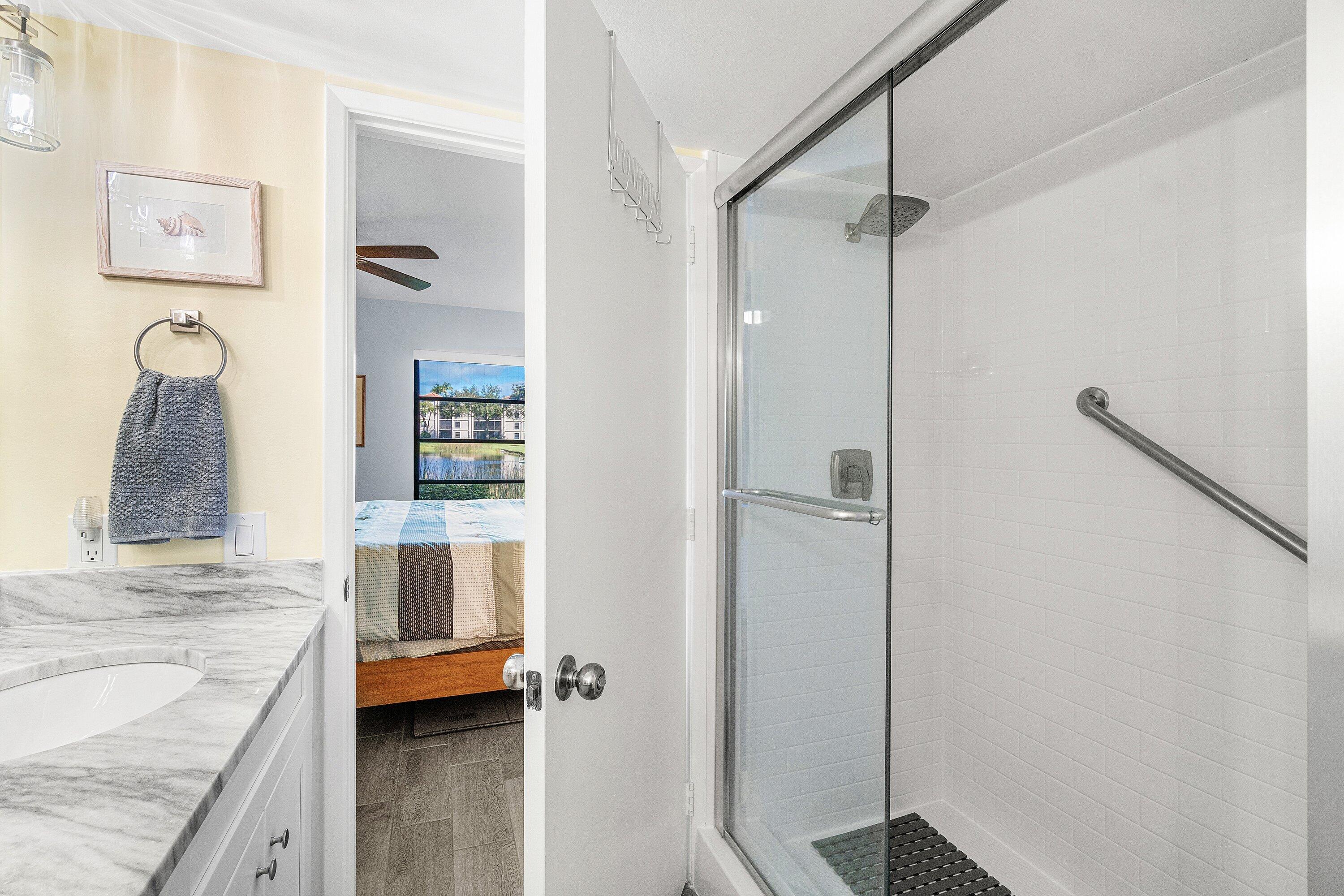 6149 Pointe Regal Circle, Unit 108 Delray Beach, FL 33484 - Photo 22 of 56 a view of a bathroom vanity and a tub