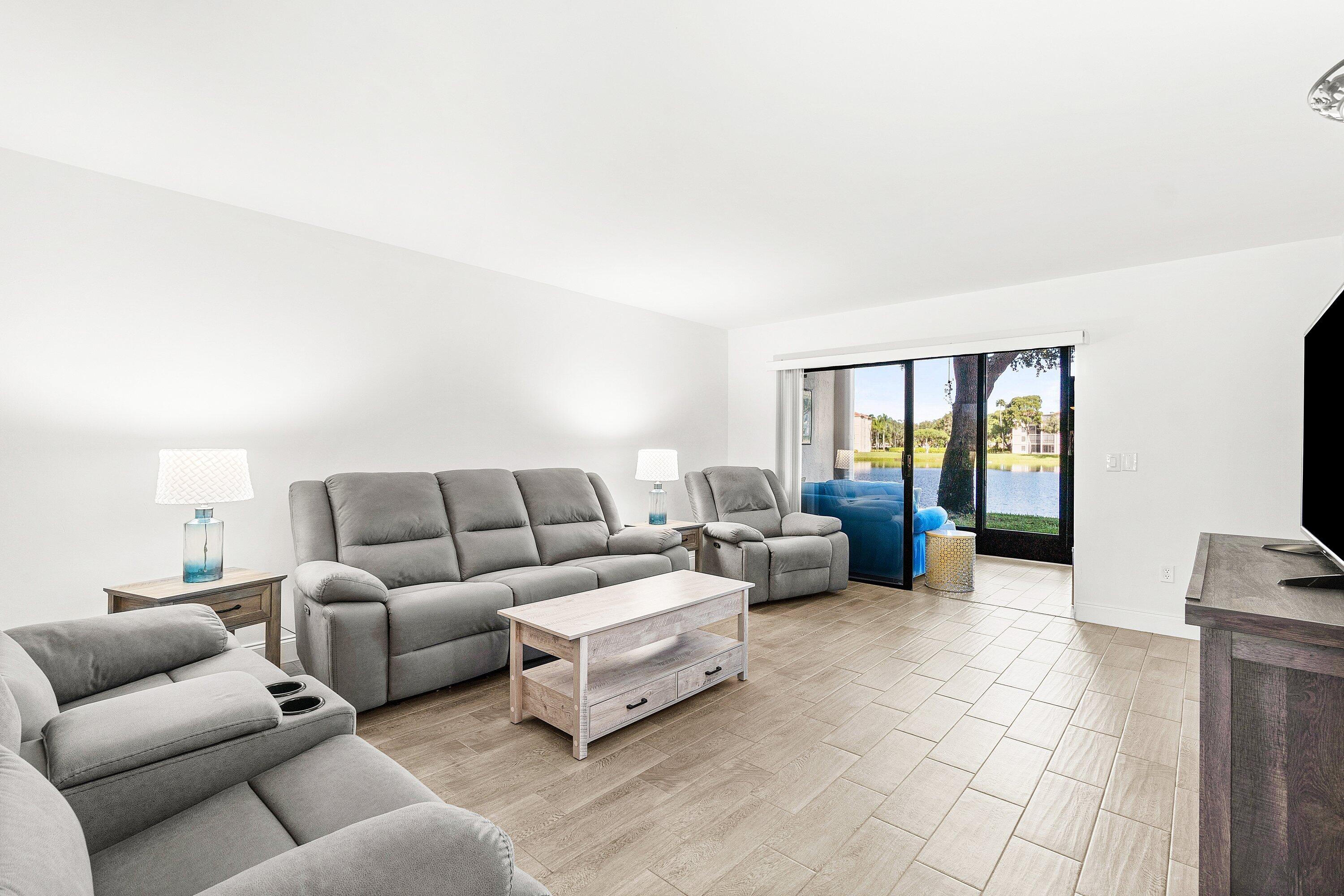 6149 Pointe Regal Circle, Unit 108 Delray Beach, FL 33484 - Photo 4 of 56 a living room with furniture and a couch